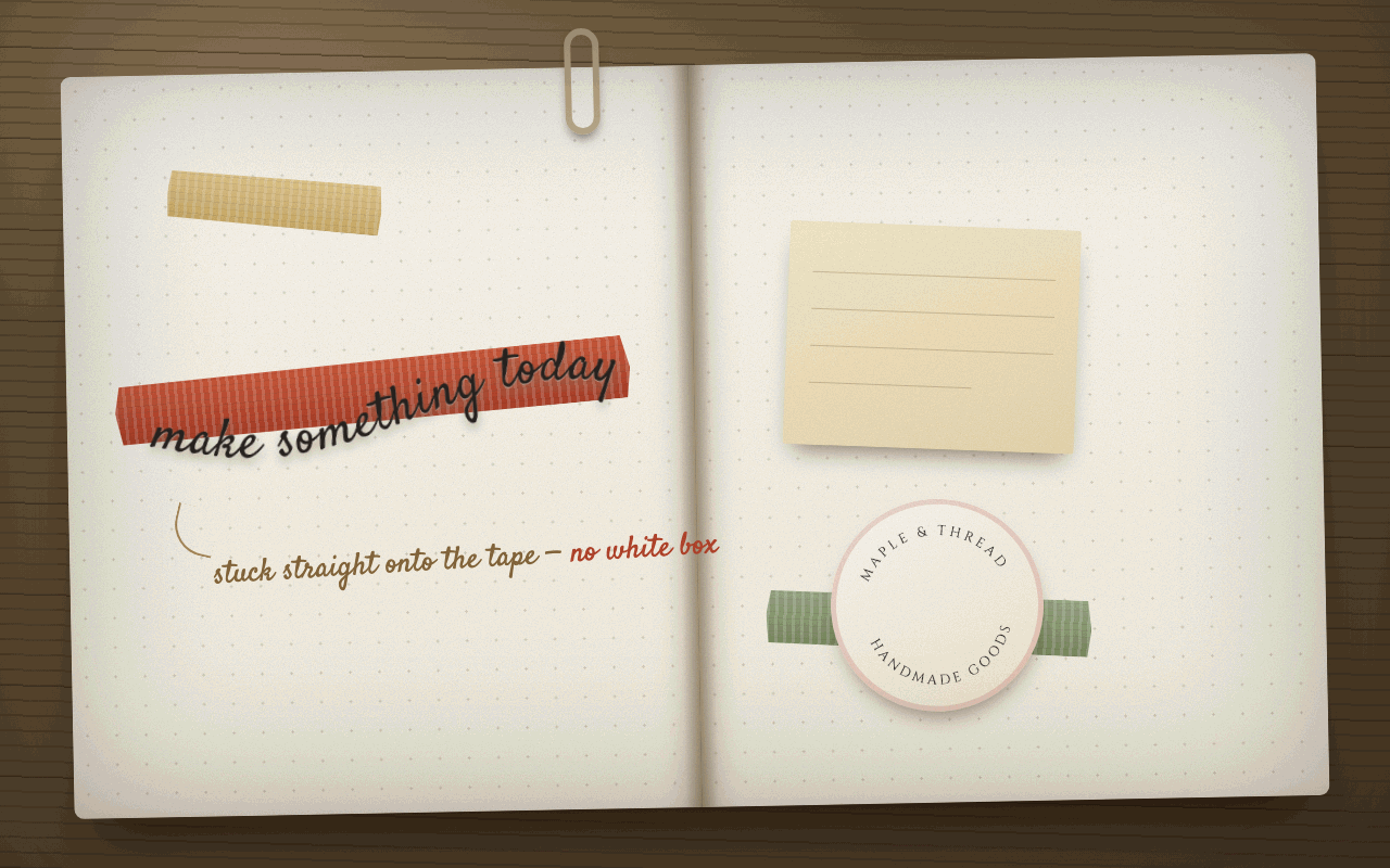 An open dotted journal with a curved phrase, make something today, stuck across a strip of red tape, and a round sticker on the facing page.